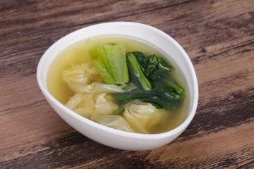 Asian traditional Wonton soup with herbs