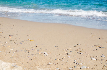 Seascape background white sea waves on golden sandy beach