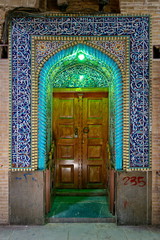 neon lit door inside Kerman Bazaar, Kerman, Iran.