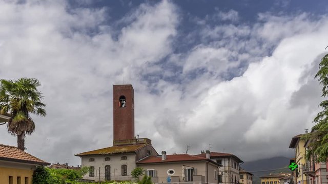 White clouds move over the dramatic sky of Bientina, a Tuscan village in the province of Pisa, Italy, with Monte Pisano in the background. Time lapse motion