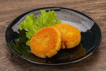 Vegan cuisine - Potato cutlet in the plate