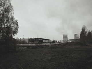 Fototapeta na wymiar abandoned factory with smoke and gray dead