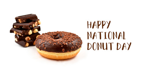 Happy Donut Day inscription with chocolate donut. National Donut Day Poster. Donut with chocolate icing on a white background. Doughnut with hazelnut chocolate stock images. American delicacy food