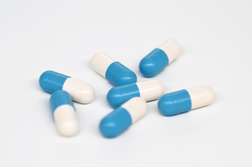 capsule medicine pills on white.
