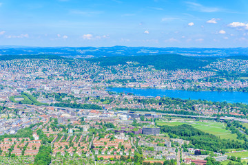 Panoramic view of Zurich lake and Alps from the top of Uetliberg mountain, from the observation platform on tower on Mt. Uetliberg, Switzerland, Europe