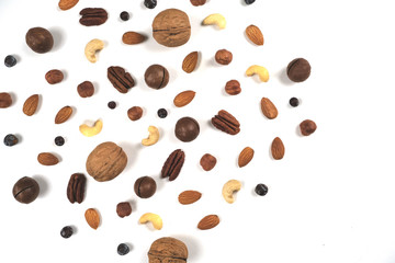 A pattern of nuts on a white background. View to the top, there is a place for inscription.