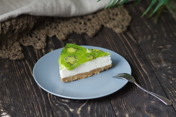 Cheesecake with kiwi. Piece of pie. Healthy food. Dish without baking