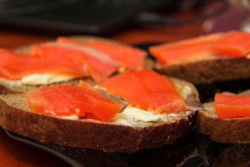 Fresh salmon sandwich with salted salmon and butter and dark bread