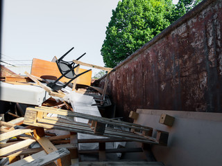 Fototapeta na wymiar Construction site with iron trash bins. Close-up.