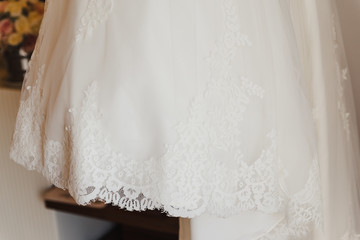 Fototapeta na wymiar White wedding dress beautiful lace closeup details