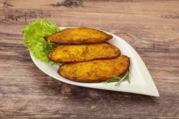 Baked potato with herbs and spices