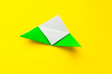 Step by step photo instruction how to make origami paper bookmark frog. Simple diy with kids children's concept.