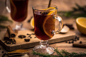 mulled wine with spices on a wooden table