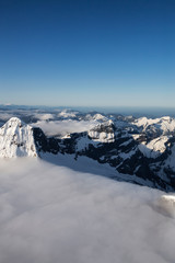 Obraz premium Aerial View of Remote Canadian Mountain Landscape during sunny sunrise. Located near Vancouver, British Columbia, Canada. Nature Background. Authentic
