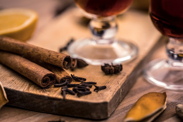 mulled wine with spices on a wooden table