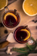 mulled wine with spices on a wooden table