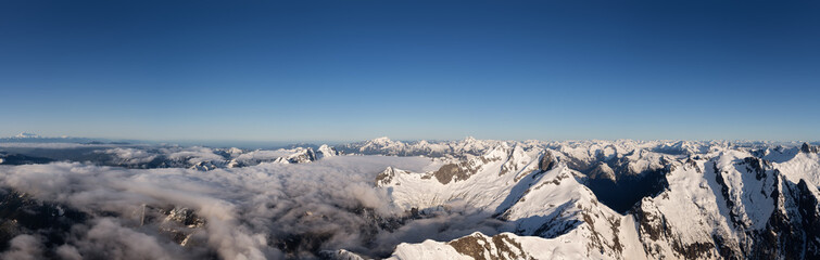Obraz premium Aerial Panoramic View of Remote Canadian Mountain Landscape during sunny morning. Located near Vancouver, British Columbia, Canada. Nature Panorama Background. Authentic