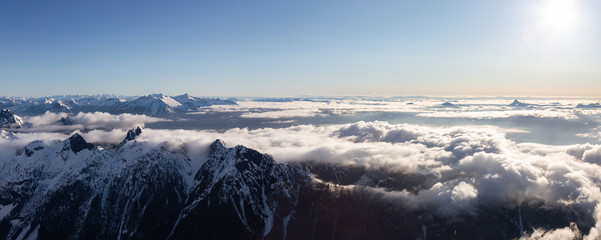 Fototapeta premium Aerial Panoramic View of Remote Canadian Mountain Landscape during sunny morning. Located near Vancouver, British Columbia, Canada. Nature Panorama Background. Authentic