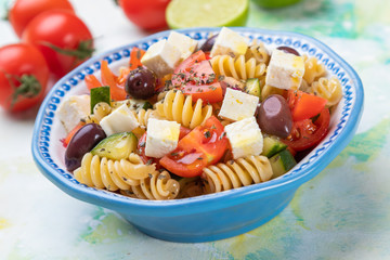 Cheese salad with pasta and fresh vegetables