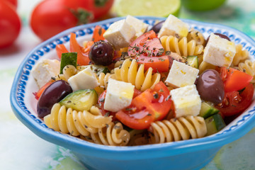 Cheese salad with pasta and fresh vegetables