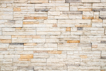 Texture and background of light colored stonewall