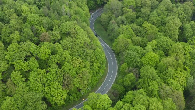 Aerial view of s-shaped rural road with traffic, Steigerwald, Germany