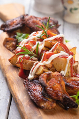 Roasted potato with chicken wings