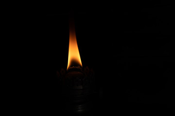 Kerosene lamp on a wooden background