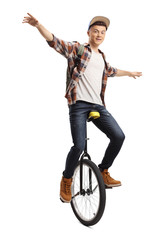 Young male student juggling on a unicycle © Ljupco Smokovski