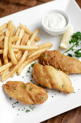 british traditional fish and chips meal on plate