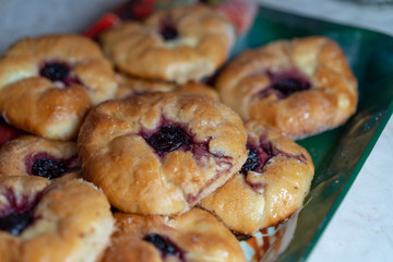 Sweet buns with cottage cheese and cherry