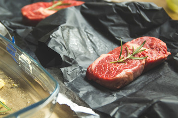 Raw fresh ribeye steak on a table prepared for the grill