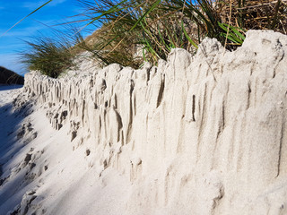 Many sand are stacked after a windy week
