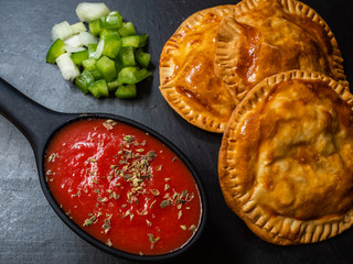HOMEMADE PASTIES BAKED WITH TUNA, TOMATO AND PEPPERS
