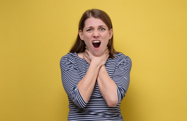 Young woman having asthma attack or choking , can not breathe.