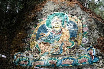 Obraz na płótnie Canvas Guru Rinpoche, Buddhism painting on the rock in the high mountain of Bhutan