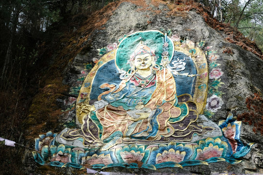 Guru Rinpoche, Buddhism painting on the rock in the high mountain of Bhutan