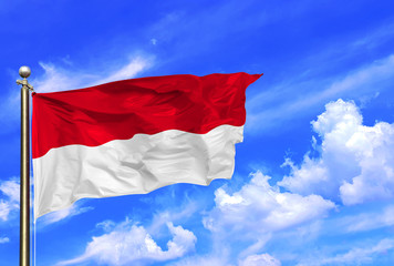 Indonesia Red And White National Flag Waving In The Wind On A Beautiful Summer Blue Sky