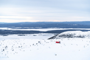 Fototapeta premium red house on top of a mountain in the Arctic circle