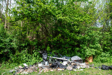 household waste dumped in nature