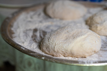 Cooked dough lies on flour for further baking