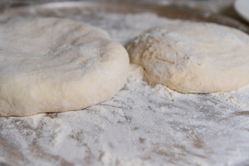 Cooked dough lies on flour for further baking