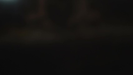 Hand turns off the TV using the remote control.