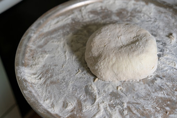 Making a pie with cheese and potato dough