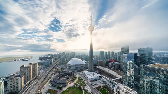Toronto, Ontario, Canada, zoom in time lapse view of cityscape showing modern buildings in the financial district on a foggy day.