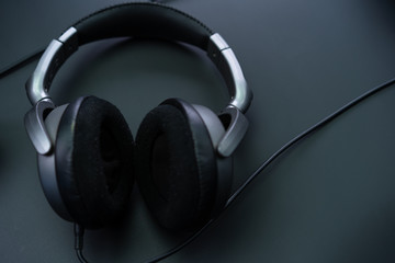 Fototapeta na wymiar Big headphones on a black background