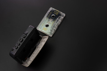 Player and cassette on a black background
