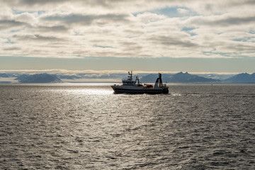 Fishing boat in Arctic sea near Longyearbyen, Svalbard archipelago