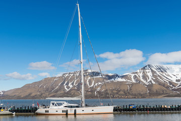 Sailing yacht in port of Longyearbyen, Svalbard archipelago