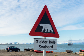 Attention - polar bear warning signs in Longyearbyen, Svalbard archipelago, Norway (Translations for non-English text: "Applies to all of Svalbard"